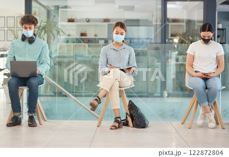 Covid, recruitment and people in waiting room social distancing and wearing face mask for safety from covid 19 virus. Hiring, company job interview and young man and women wait for business interview Covid, recruitment and people in waiting room social distancing and wearing face mask for safety from covid 19 virus. Hiring, company job interview and young man and women wait for business interview 122872804