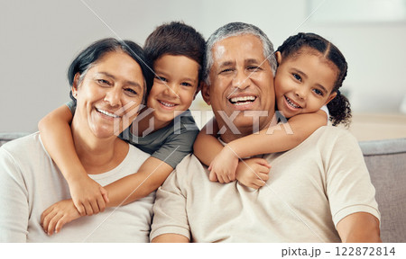Grandparents, grandkids and hug portrait of family relax, love and care on lounge sofa at home. Smile, play and happy children, senior grandma and funny elderly grandpa bond together for quality time Grandparents, grandkids and hug portrait of family relax, love and care on lounge sofa at home. Smile, play and happy children, senior grandma and funny elderly grandpa bond together for quality time 122872814
