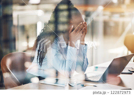 Stress, anxiety and burnout with a business woman suffering with mental health in her office at work. Headache, fatigue and overtime with a stressed female employee at work on a laptop at her desk 122872973