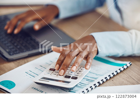 Calculator, accounting and financial accountant with finance documents to check sales revenue of the company in an office. Data analysis, inflation and African employee working on budget spreadsheet Calculator, accounting and financial accountant with finance documents to check sales revenue of the company in an office. Data analysis, inflation and African employee working on budget spreadsheet 122873004