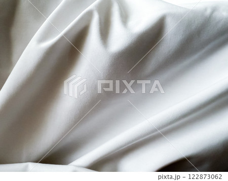 Close up texture on white blanket, The blanket is wrinkled. Close up texture on white blanket, The blanket is wrinkled. 122873062