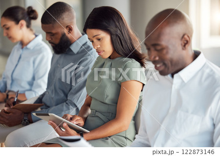 Corporate seminar and tablet for business notes for company workplace training audience. Employees at workshop with focus and concentration writing in notebook or typing on digital tech. 122873146