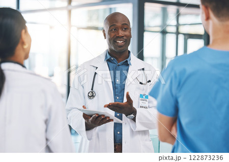 Team, nurse and medical doctors in a discussion about healthcare report, review and results in a hospital. Global, teamwork and leader in conversation with nursing professionals after office meeting 122873236