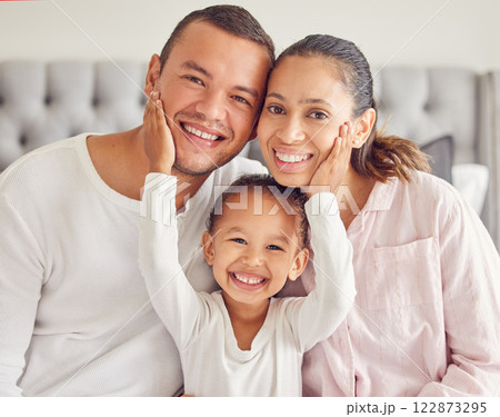 Happy family, morning bonding and love from child with mother and father in their bedroom after waking up and wearing pajamas. Portrait of man, woman and daughter showing smile and close bond at home Happy family, morning bonding and love from child with mother and father in their bedroom after waking up and wearing pajamas. Portrait of man, woman and daughter showing smile and close bond at home 122873295