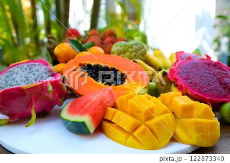 Thai Fresh Exotic Fruits (Pineapple, Coconut, Mango, Rambutan, Masngosteen, Dragon Fruit, Rose Apple, Sugar Apple, Snake Fruit) on the Table. Healthy Vitamin Nutritious Food. Thailand.  122873340