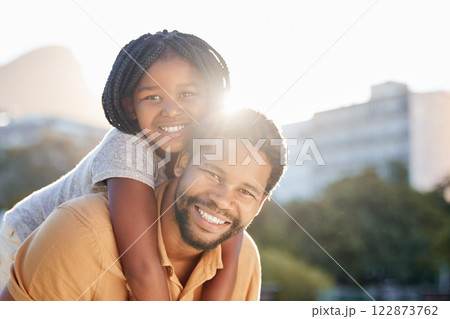 Happy black father carrying girl, child or kid outdoors in nature park outside. Portrait, support and love of caring male parent bonding with daughter with a smile together while taking a walk. Happy black father carrying girl, child or kid outdoors in nature park outside. Portrait, support and love of caring male parent bonding with daughter with a smile together while taking a walk. 122873762