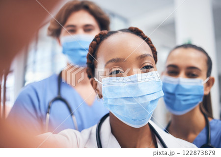 Covid, selfie and medical healthcare team happy about teamwork in a hospital or clinic. Portrait of a black woman doctor with nurse group together ready to start on employee collaboration or surgery 122873879