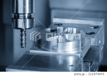 The CNC milling machine cutting  aluminum part by solid flat nose end mill tool. 122874043