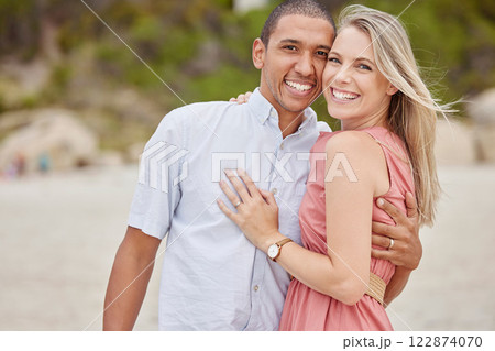Love, smile and couple outdoor portrait at the beach for the holiday vacation. Happy marriage with husband and wife or interracial people together for honeymoon, wellness and healthy lifestyle Love, smile and couple outdoor portrait at the beach for the holiday vacation. Happy marriage with husband and wife or interracial people together for honeymoon, wellness and healthy lifestyle 122874070