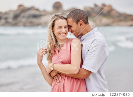 Travel, beach and couple hug, happy and laughing while bonding outdoors, enjoying the view of the ocean. Love, relationship and water fun with relax man and woman on seaside trip in San francisco Travel, beach and couple hug, happy and laughing while bonding outdoors, enjoying the view of the ocean. Love, relationship and water fun with relax man and woman on seaside trip in San francisco 122874080