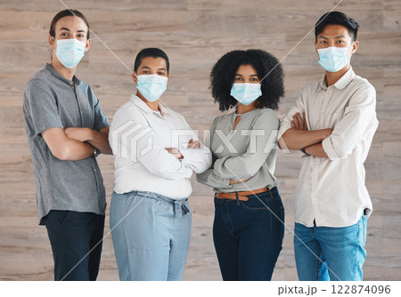 Portrait of diversity team with mask for covid safety, health or protection from bacteria, virus or covid 19. A group of people, staff or workforce standing together in solidarity and support Portrait of diversity team with mask for covid safety, health or protection from bacteria, virus or covid 19. A group of people, staff or workforce standing together in solidarity and support 122874096