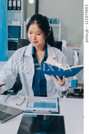 Implement those changes and we can see. Shot of a group of nurses and doctors having a meeting together. 122874663