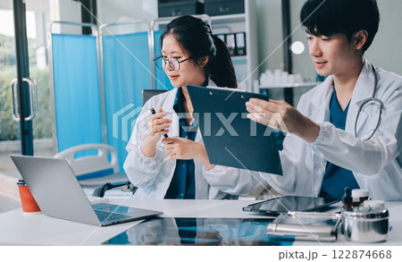 Implement those changes and we can see. Shot of a group of nurses and doctors having a meeting together. 122874668