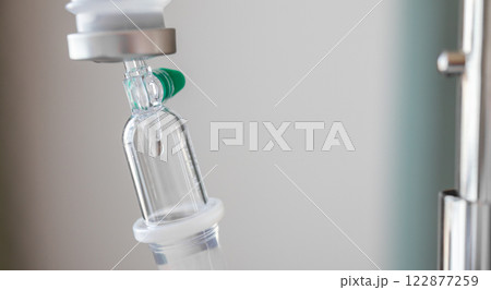 Close up medical intravenous IV drip in hospital background 122877259