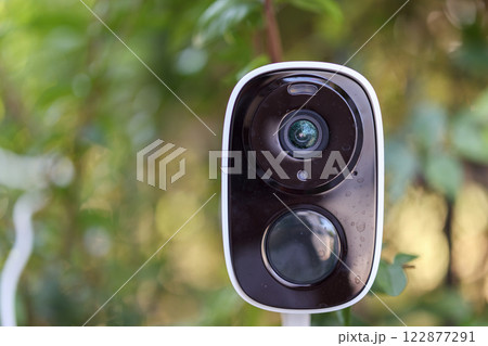 Security IP CCTV camera using solar energy install on the tree for home security system Security IP CCTV camera using solar energy install on the tree for home security system 122877291