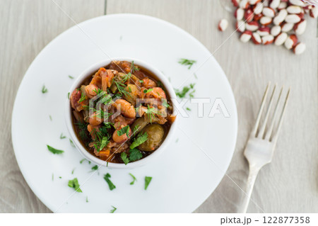 beans cooked with Brussel sprouts, tomatoes and other vegetables 122877358
