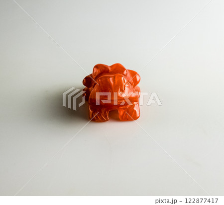Carnelian frog that brings good luck. On a white background. 122877417
