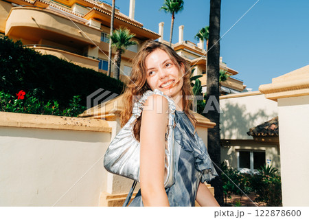 Modern femininity: soft power dressing meets high-end real estate, capturing aspirational living 122878600