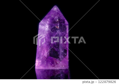 Macro mineral stone Amethyst crystal on a black background Macro mineral stone Amethyst crystal on a black background 122879826