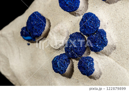 Macro mineral stone Azurite in siltstone against black background Macro mineral stone Azurite in siltstone against black background 122879899