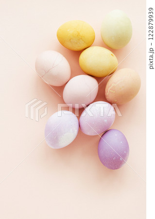 Natural dying Easter eggs on peach background. Easter greeting card. Natural dying Easter eggs on peach background. Easter greeting card. 122879939
