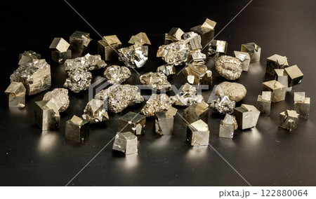 Macro mineral stone Pyrite on a black background 122880064