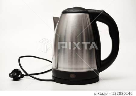 Electric kettle on a white background. A metal teapot with a black handle. 122880146