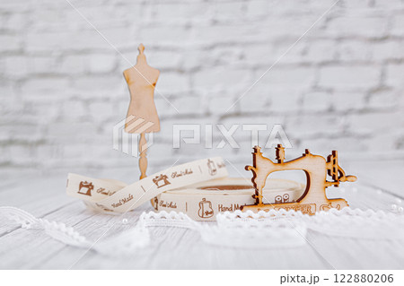 sewing tape, sewing machine and wood mannequin 122880206