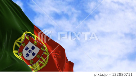 Portugal national flag waving in the wind on a clear day 122880711
