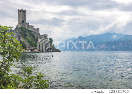 Lake Garda with The Scaliger Castle in Malcesine town on the eastern shore of the lake, Italy, Europe. Lake Garda with The Scaliger Castle in Malcesine town on the eastern shore of the lake, Italy, Europe. 122881709