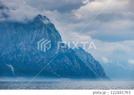 Lake Garda with mountains in background, view from Malcesine town on the eastern shore of the lake, Italy, Europe. 122881763