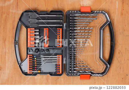 Drill and screwdriver bits set in a plastic carrying case. 122882033