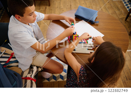 Children Organizing Colorful Art Supplies 122882749