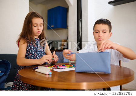 Children doing crafts together indoors Children doing crafts together indoors 122882795