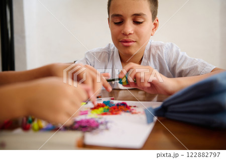 Boy Sharpening Colored Pencils 122882797