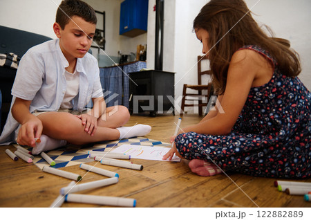 Children Drawing Together on Floor Children Drawing Together on Floor 122882889