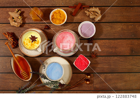 A variety of Japanese tea, matcha latte, golden turmeric, lavender blue and pink moon milk. The trendy healthy drink promotes weight loss, relaxes before bed and has anti-inflammatory properties.. A variety of Japanese tea, matcha latte, golden turmeric, lavender blue and pink moon milk. The trendy healthy drink promotes weight loss, relaxes before bed and has anti-inflammatory properties.. 122883748
