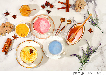 A range of colourful Japanese tea lattes in golden turmeric, lavender blue and pink moon milk. The trendy healthy drink matcha promotes weight loss, relaxes before bed and has anti-inflammatory A range of colourful Japanese tea lattes in golden turmeric, lavender blue and pink moon milk. The trendy healthy drink matcha promotes weight loss, relaxes before bed and has anti-inflammatory 122883750