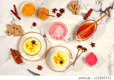 A variety of Japanese tea lattes made from golden turmeric and pink moon milk. The trendy healthy drink matcha promotes weight loss, relaxes before bed and has anti-inflammatory properties. 122883751
