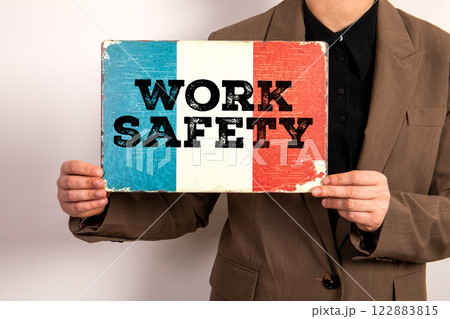 Work Safety. French flag in the hands of a business woman Work Safety. French flag in the hands of a business woman 122883815