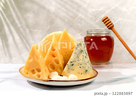 Blue cheese, Roquefort, Parmesan, Mozzarella, Maasdam with honey, Assortment of different types of cheese, Healthy and natural food selection, Advertising postcard for cafe and menu 122883897
