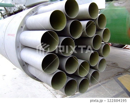 This close-up view showcases a high precision rocket launcher system featuring multiple launch tubes arranged in a circular formation. This close-up view showcases a high precision rocket launcher system featuring multiple launch tubes arranged in a circular formation. 122884195