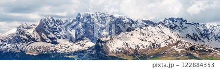 Majestic snow-capped mountain range under cloudy sky landscape panorama near Valley of Funes at Dolomites, Italy Majestic snow-capped mountain range under cloudy sky landscape panorama near Valley of Funes at Dolomites, Italy 122884353