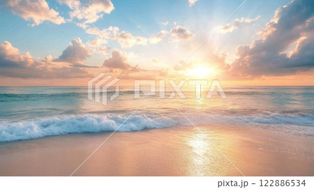 The sun is setting over the ocean, casting a warm glow on the water 122886534