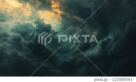 The sky is dark and cloudy, with a few rays of sunlight peeking through 122886561