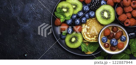 Weekend Brunch Setting with Fresh Fruits and Pancakes on Table Weekend Brunch Setting with Fresh Fruits and Pancakes on Table 122887944
