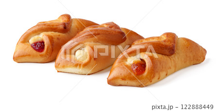 Delicious bakery sweets with fruit filling displayed on a clean white surface ready to enjoy for breakfast or snacks 122888449
