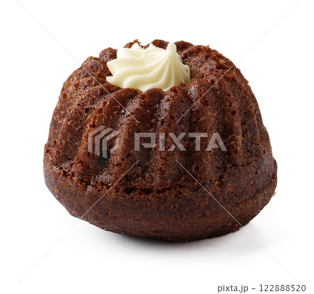 Delicious chocolate bundt cake topped with cream, perfect for dessert or celebration gatherings Delicious chocolate bundt cake topped with cream, perfect for dessert or celebration gatherings 122888520