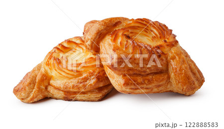 Freshly baked pastries showcasing flaky golden layers ready for enjoyment at a cozy bakery 122888583