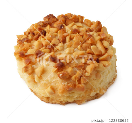 Delicious cookie topped with crushed nuts sits on a plain background ready to be enjoyed Delicious cookie topped with crushed nuts sits on a plain background ready to be enjoyed 122888635